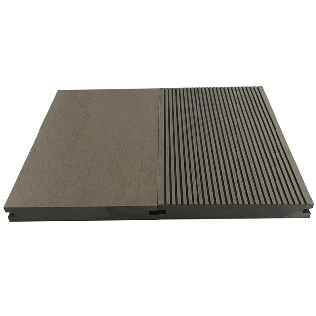 Wood plastic composite solid decking material