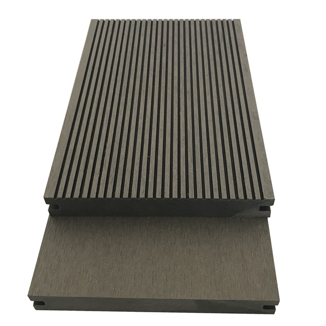 Wood plastic composite solid decking material