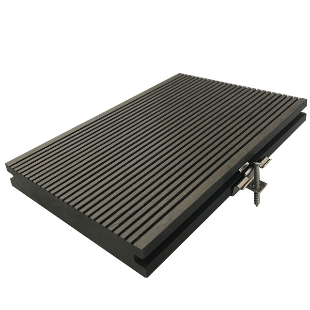 Wood plastic composite solid decking material